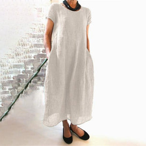 Ensfarvet løs kjole i bomuld med rund hals