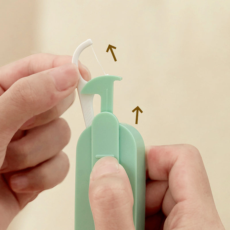 Bærbar to-vejs tandtrådsdispenser